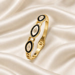 Noor Black Enamel Gold Bangle flatlay