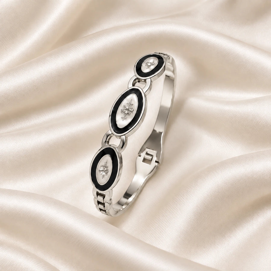 Noor Black Enamel Silver Bangle flatlay