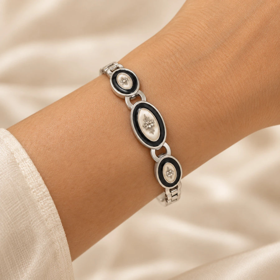Noor Black Enamel Silver Bangle worn on wrist