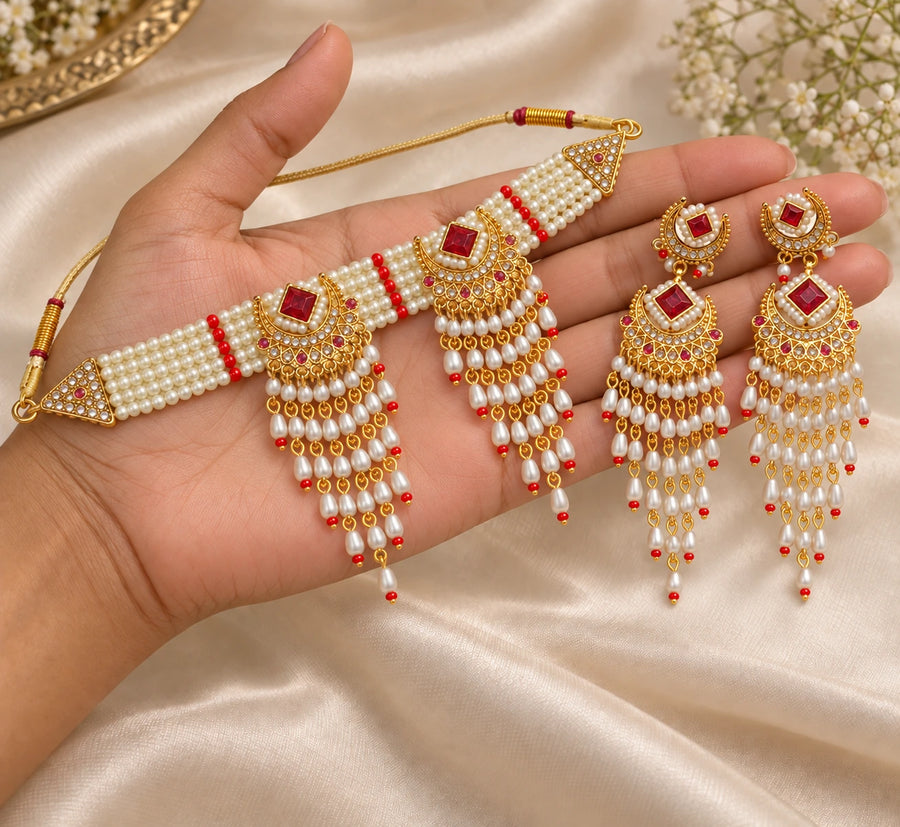 Ruhani Ruby Pearl Choker Set presented in hand