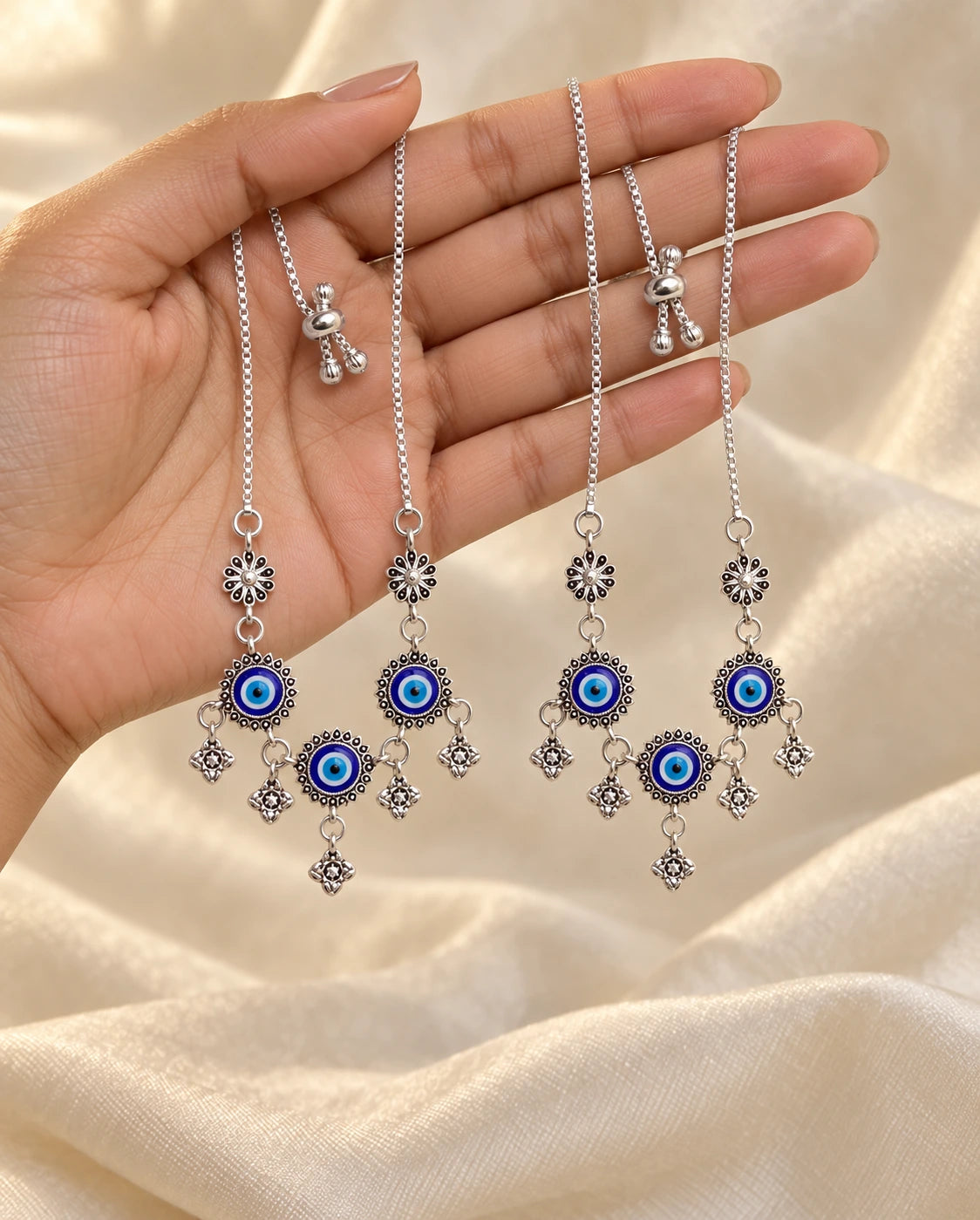Trinetra Nazar Payal Pair presented in hand