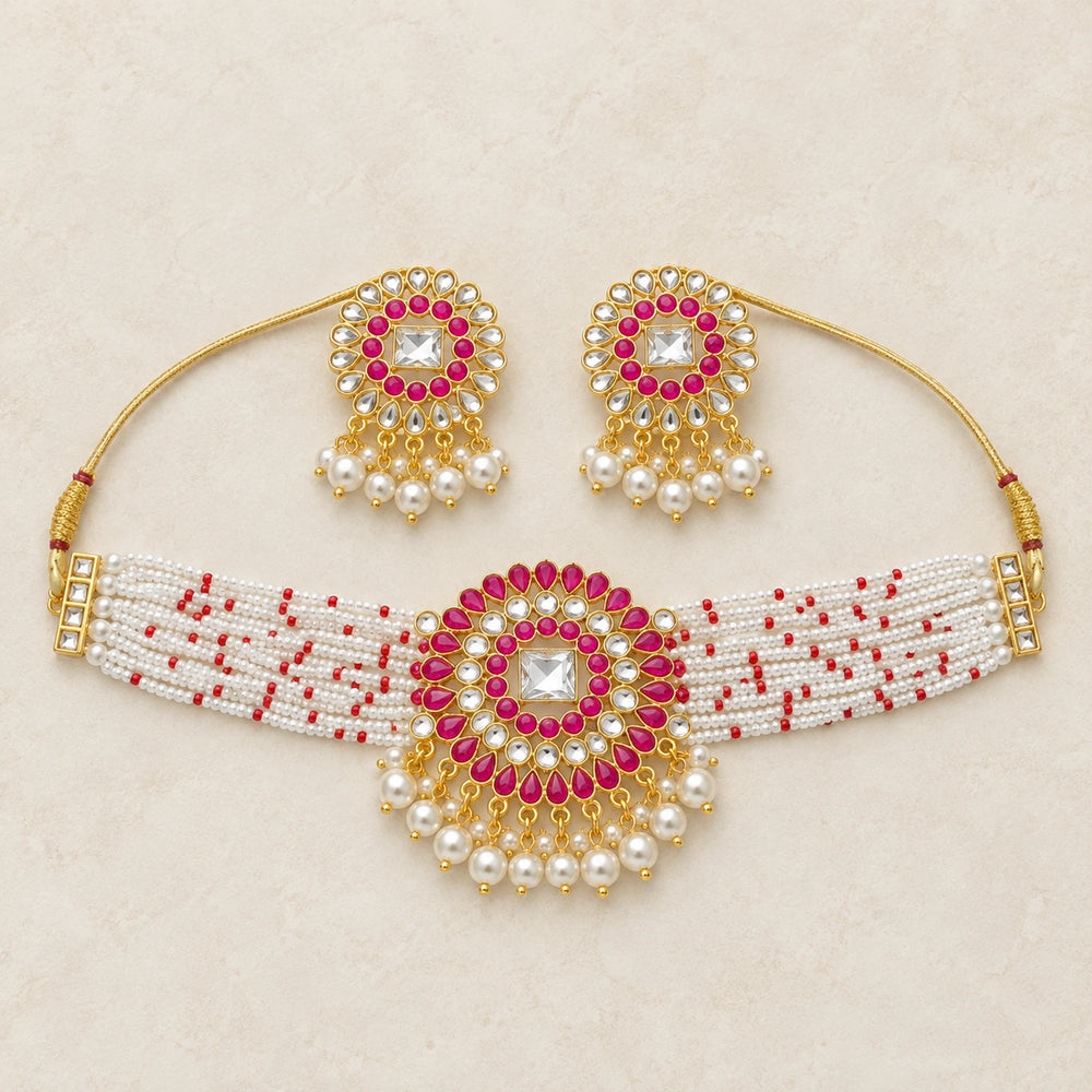 Magenta kundan pearl choker necklace and earrings set flatlay hero