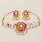 Magenta kundan pearl choker necklace and earrings set flatlay hero