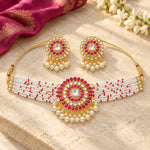 Magenta kundan pearl choker necklace and earrings lifestyle setting