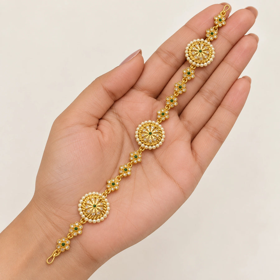 Meher Pearl Emerald Gold Shishphool Headpiece — hand presentation