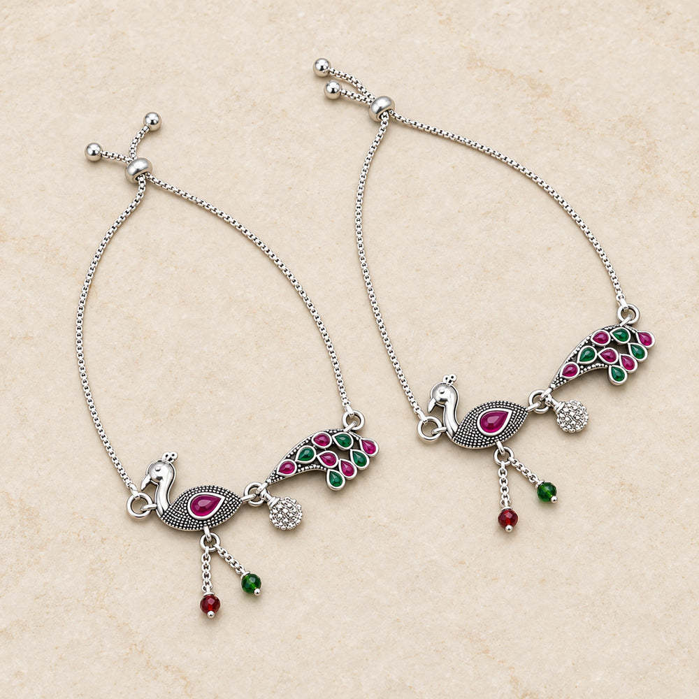 Oxidized silver peacock payal anklet pair flatlay hero view