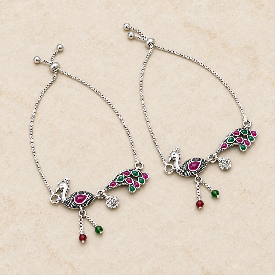 Oxidized silver peacock payal anklet pair flatlay hero view